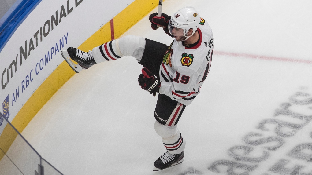 Chicago Blackhawks' Jonathan Toews (19) celebrates a goal against the Vegas Golden Knights during first period NHL Western Conference Stanley Cup playoff action in Edmonton on Tuesday, August 18, 2020. THE CANADIAN PRESS/Jason Franson