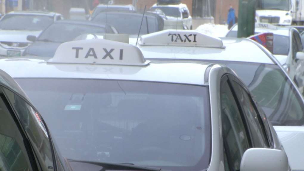 Taxi cabs can be seen lined up in Winnipeg.