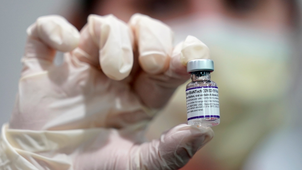 A health-care worker holds a vial of the Pfizer COVID-19 vaccine at Jackson Memorial Hospital in Miami, in this Tuesday, Oct. 5, 2021, file photo. (AP Photo/Lynne Sladky, File) 