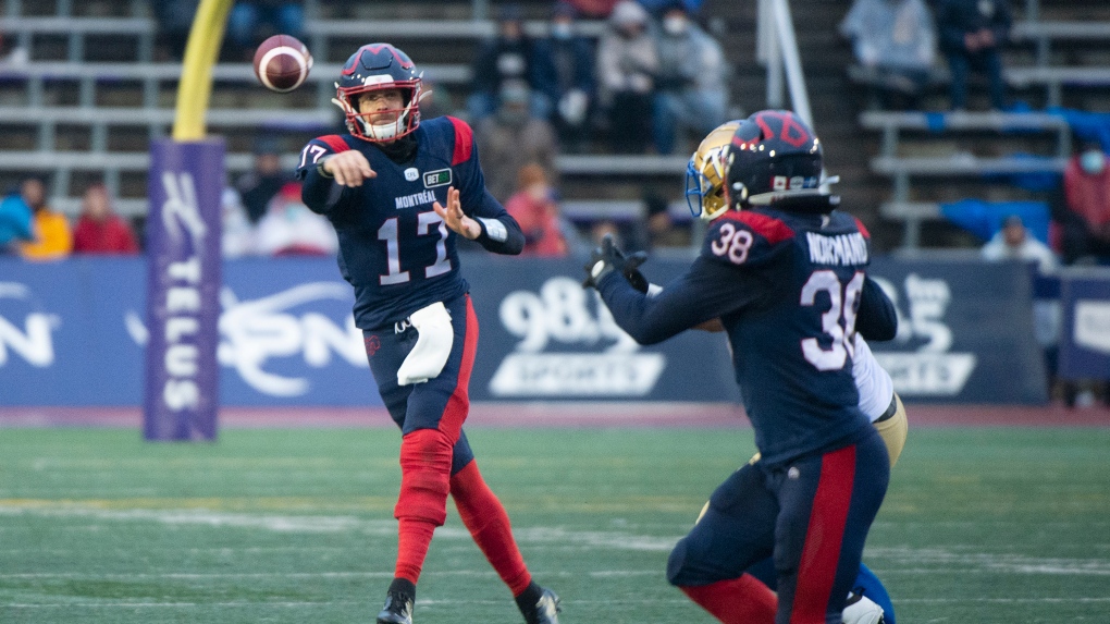 Montreal Alouettes quarterback Trevor Harris (17) throws a pass towards teammate Christophe Normand during second half CFL football action against the Winnipeg Blue Bombers, in Montreal, Saturday, Nov. 13, 2021. (THE CANADIAN PRESS/Graham Hughes) 