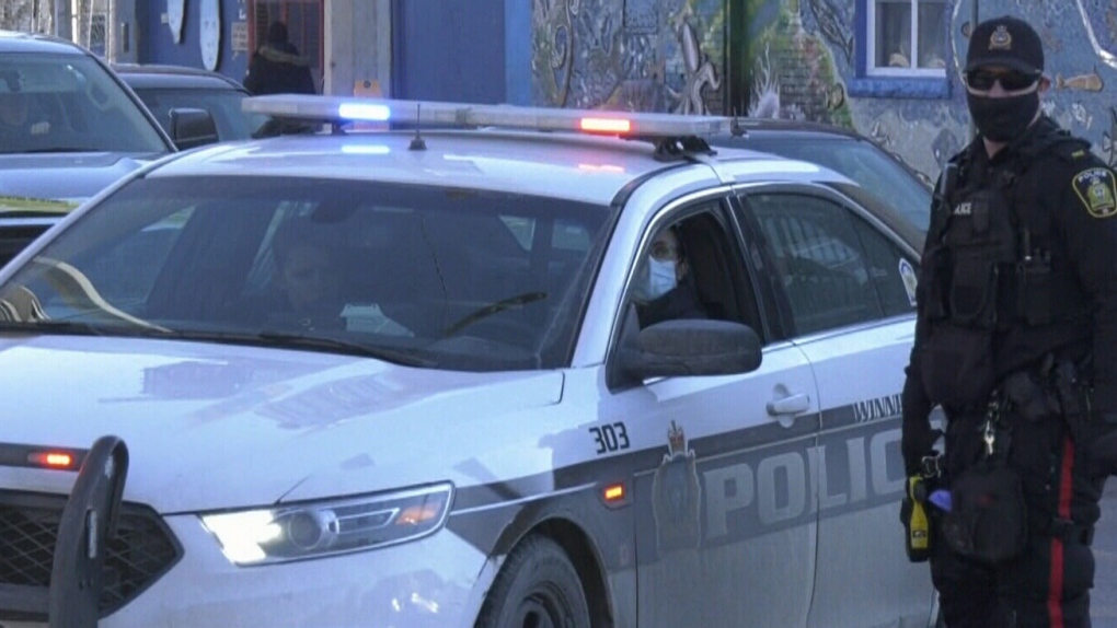 Winnipeg police officers respond to an assault on Nov. 27, 2021, at Main Street and Logan Avenue in Winnipeg that left one man in hospital in critical condition. The man later died of his injuries. (Source: CTV News Winnipeg) 