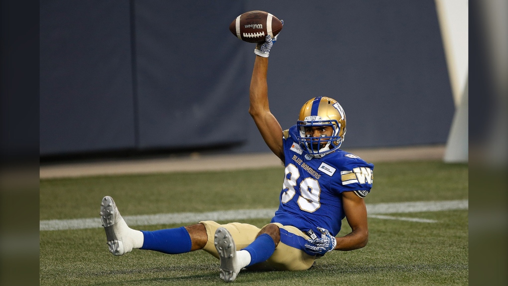 Winnipeg Blue Bombers wide receiver Kenny Lawler (89) celebrates his touchdown against Hamilton Tiger-Cats during first half CFL action in Winnipeg Thursday, August 5, 2021. (THE CANADIAN PRESS/John Woods) 