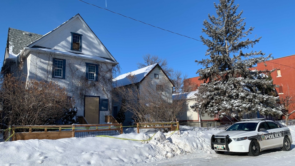 Winnipeg police remain on the scene of a fatal shooting in the 400 block of Young Street on Jan. 23, 2022.