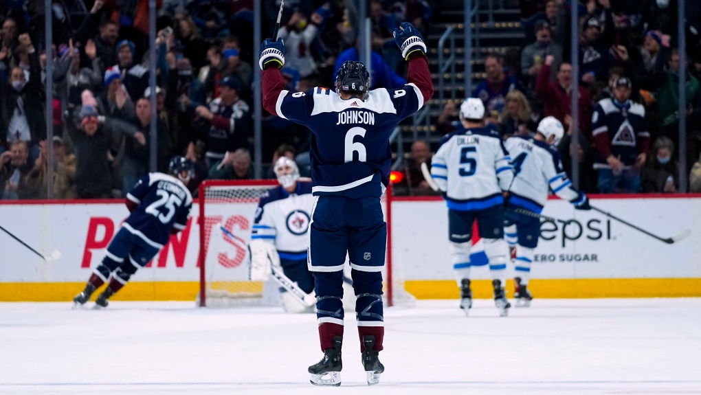 Colorado Avalanche defenseman Erik Johnson (6) celebrates an Avalanche goal against the Winnipeg Jets during the first period of an NHL hockey game Thursday, Jan. 6, 2022, in Denver. (AP Photo/Jack Dempsey) 