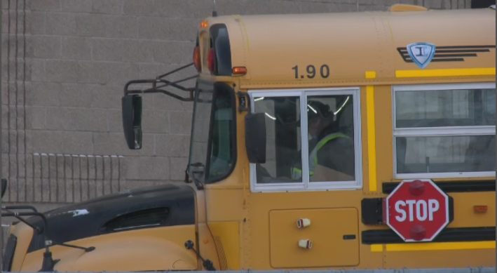 A bus driver waiting outside a school in Winnipeg. Dec. 2, 2022. (Source: Jamie Dowsett/CTV News)