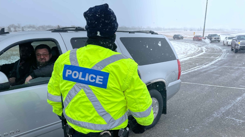 Police stop vehicles on the westbound exit ramp onto the Perimeter Highway on Dec. 2, 2022 as part of National Impaired Driving Enforcement Day. (Source: Jamie Dowsett/CTV News Winnipeg)