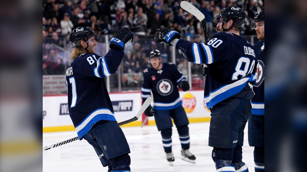 Winnipeg Jets’ Kyle Connor (81) celebrates his goal against the Florida Panthers with Pierre-Luc Dubois (80) during second period NHL action in Winnipeg on Tuesday, December 6, 2022. THE CANADIAN PRESS/Fred Greenslade