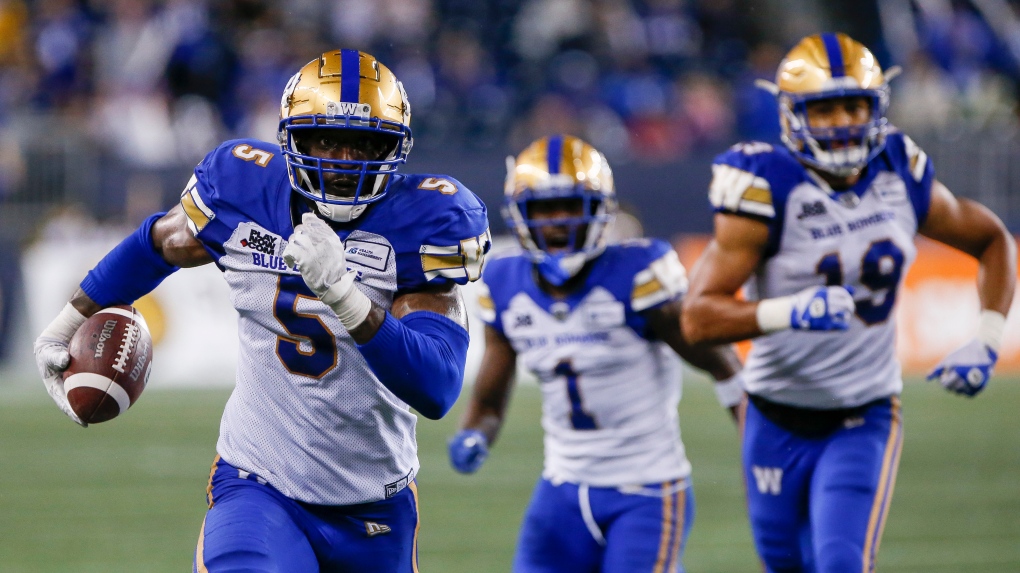 Winnipeg Blue Bombers' Willie Jefferson (5) runs in his interception for the touchdown against the Hamilton Tiger-Cats during the second half of CFL action in Winnipeg, Friday, June 24, 2022. THE CANADIAN PRESS/John Woods