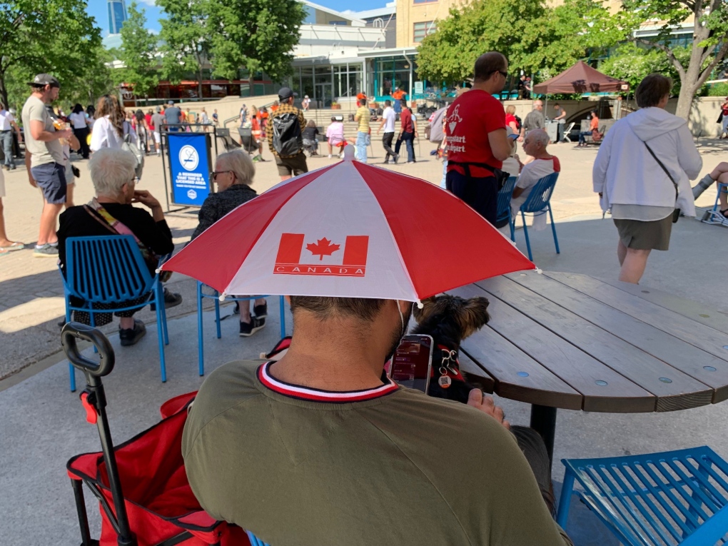 Visitors enjoy the nice weather at The Forks, July 1, 2022. (Source: Gary Robson, CTV News Winnipeg)
