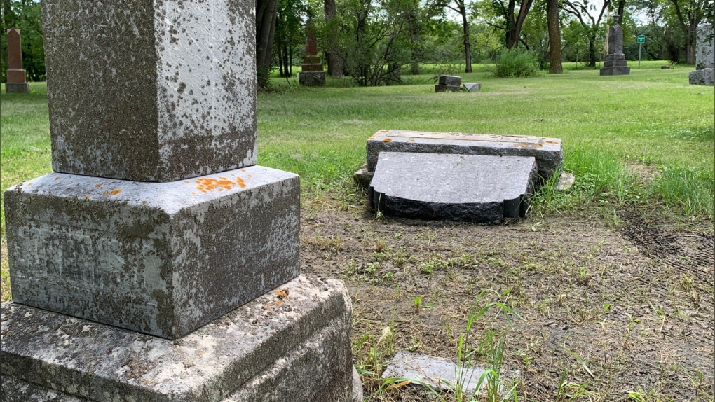 A knocked-over headstone at Brookside Cemetery. Photo taken July 24, 2022 (Source: Gary Robson, CTV News Winnipeg)
