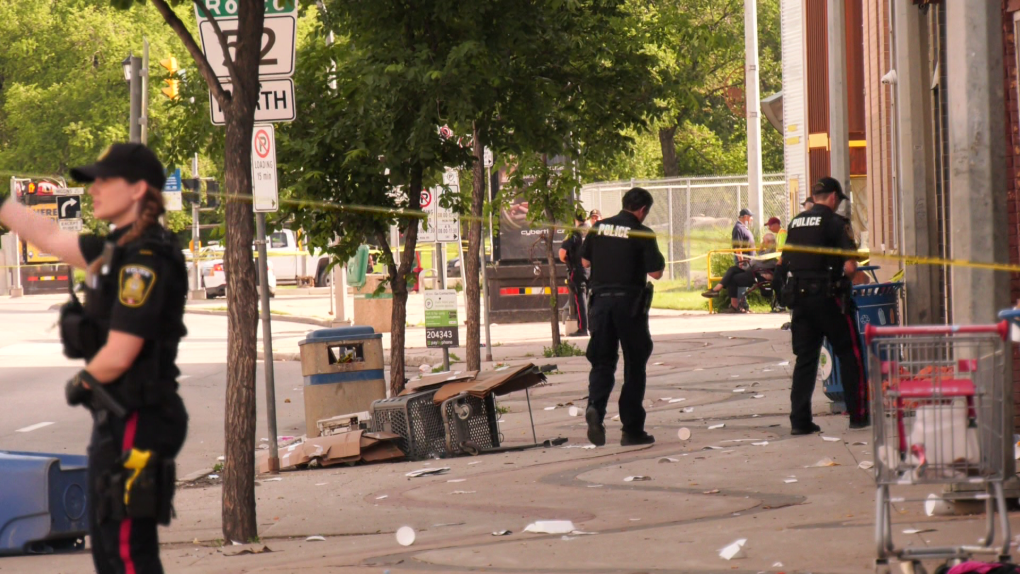Winnipeg police secure the scene of an incident on Main Street between Logan and Higgins Avenue that sent a person to hospital on July 5, 2022. (CTV News Photo Owen Swinn)