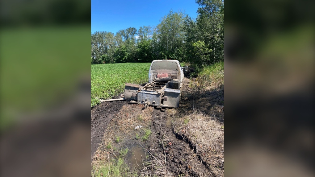A stolen truck is found stuck in mud on a property in the RM of Lakeshore (supplied photo: RCMP)