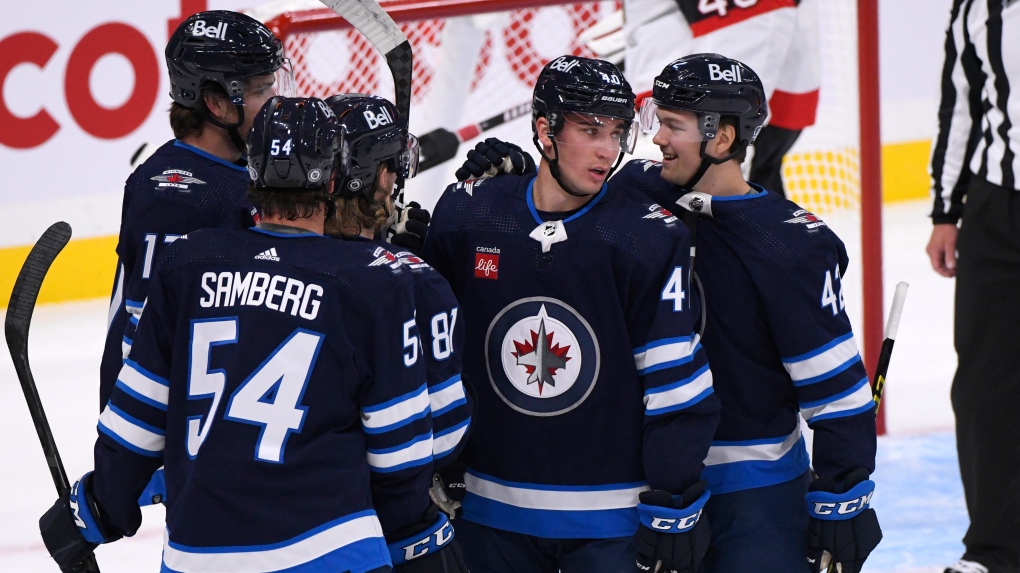 Winnipeg Jets' Daniel Torgersson (40) celebrates his goal against the Ottawa Senators with Simon Lundmark (42) and Dylan Samberg (54) during the first period of NHL pre-season action in Winnipeg on Sunday September 27, 2022. THE CANADIAN PRESS/Fred Greenslade