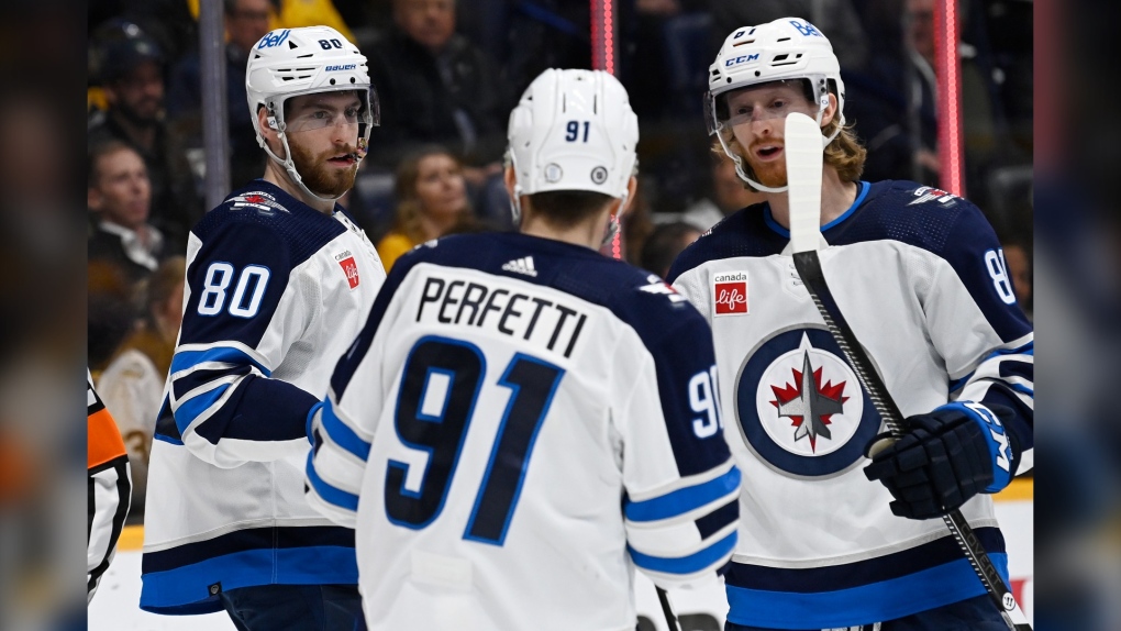 Winnipeg Jets left wing Pierre-Luc Dubois (80) is congratulated after a goal against the Nashville Predators during the first period of an NHL hockey game Tuesday, Jan. 24, 2023, in Nashville, Tenn. (AP Photo/Mark Zaleski)