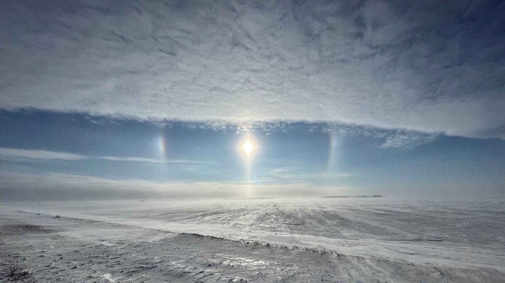 A sun dog is shown cutting through the clouds and blowing snow in this Jan. 27, 2023 photo taken near Domain, Man. (Source: Blair Thorsteinson)