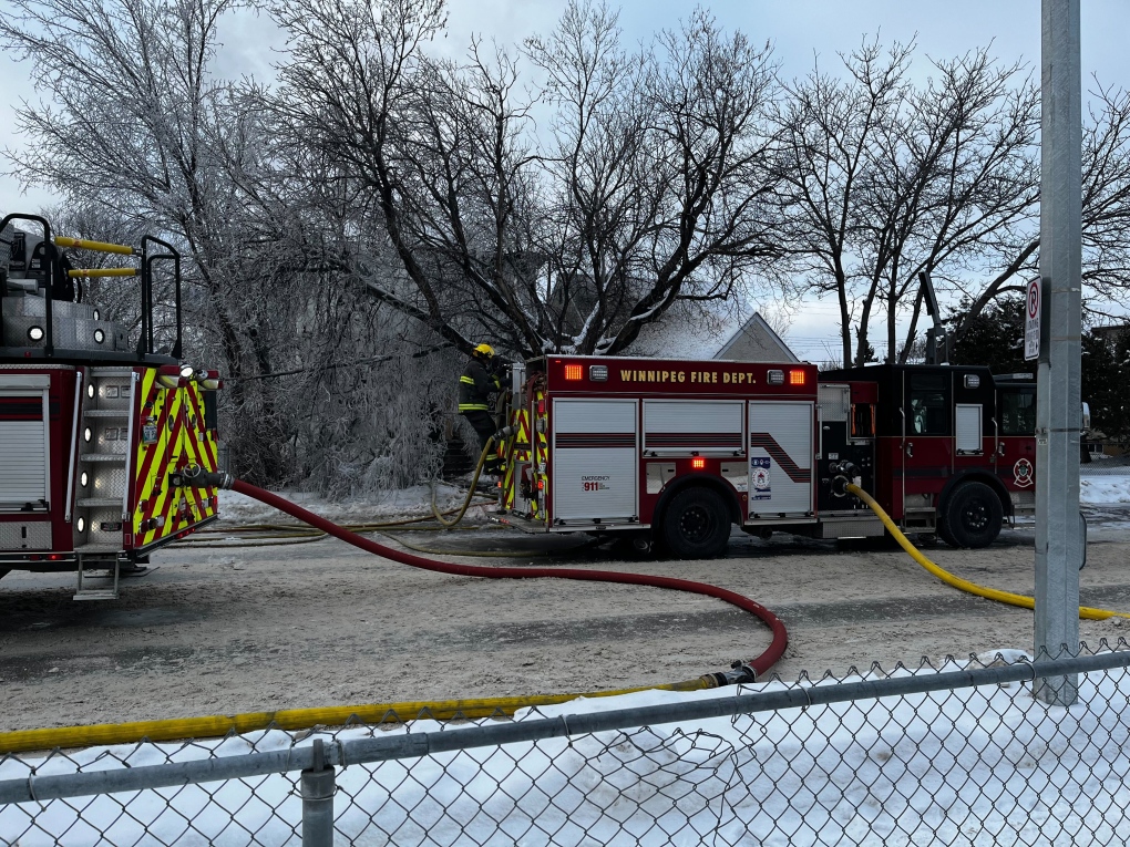 Firefighters respond to a fire in a vacant home on Selkirk Avenue on Dec. 30, 2022. The City of Winnipeg is looking at the possibility of having owners of vacant properties pay for firefighting costs (Image source: Ken Gabel/CTV News Winnipeg)