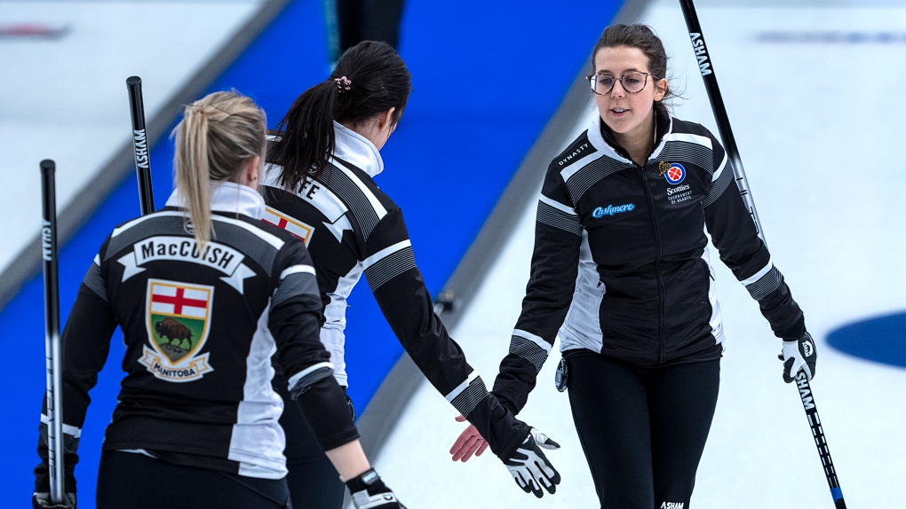Wild Card 1 skip Selena Njegovan, right, acknowledges lead Kristin MacCuish and second Liz Fyfe after a shot as they play Newfoundland and Labrador at the Scotties Tournament of Hearts at Fort William Gardens in Thunder Bay, Ont. on Wednesday, Feb.2, 2022. THE CANADIAN PRESS/Andrew Vaughan