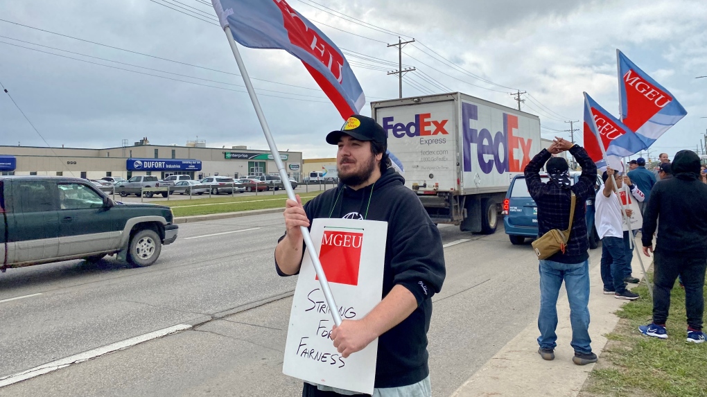 Employees with the Manitoba Government and General Employees’ who work for Manitoba Liquor and Lotteries take part in strike action on July 19, 2023. (Image source: Scott Andersson/CTV News Winnipeg)
